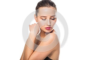 Beauty Spa Woman with perfect skin Portrait. Beautiful girl looking down on white background.
