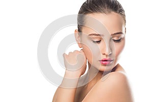 Beauty Spa Woman with perfect skin Portrait. Beautiful girl looking down on white isolated background.