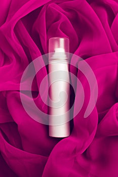 Beauty spray (aerosol) over pink (purple) vapory cloth