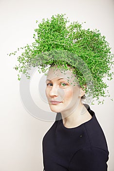 Beauty Spring Woman with Fresh Green Thyme Hair. Summer Nature Girl portrait.