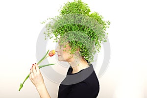 Beauty Spring Woman with Fresh Green Thyme Hair. Summer Nature Girl portrait.