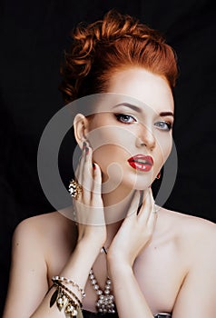 Beauty stylish redhead woman with hairstyle and manicure wearing