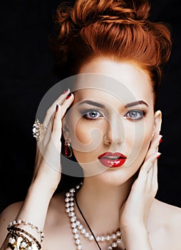 Beauty stylish redhead woman with hairstyle and manicure wearing