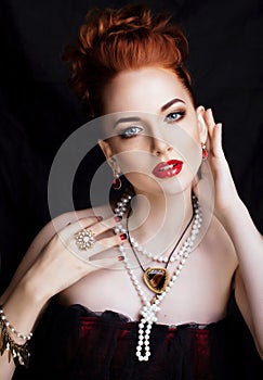 Beauty stylish redhead woman with hairstyle and manicure wearing