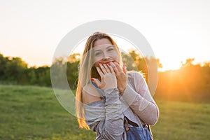 Beauty Sunshine Girl Portrait. Happy Woman Smiling. Sunny Summer Day under the Hot Sun.