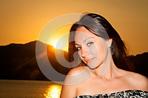 Beauty Sunshine Girl Portrait. Happy Woman Smiling, Sunny Summer Day under the Hot Sun on the Beach.