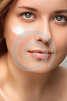 Beauty, suntan spf and skincare cosmetics model face portrait, woman with moisturising cream, sunscreen product or sun