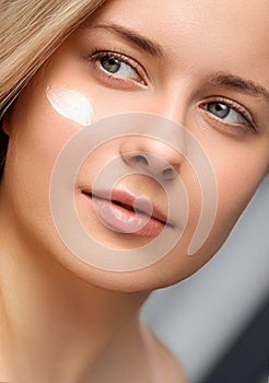 Beauty, suntan spf and skincare cosmetics model face portrait, woman with moisturising cream, sunscreen product or sun