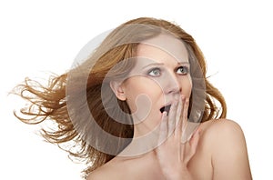 Beauty surprised amazed girl with flowing hair