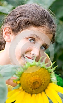 Beauty teen girl and sunflower