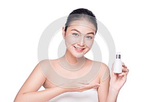 Beauty treatment. Asian woman holding serum treatment bottle