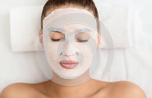 Beauty Treatment Concept. Woman With Facial Sheet Mask