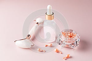 Beauty treatment cosmetic set for dayl skin care routine. Single dose serum capsules. brauty oil in dropper bottle and rose quartz