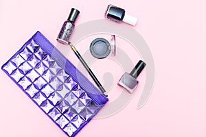 Beauty of ultraviolet color and cosmetics on a pink background.