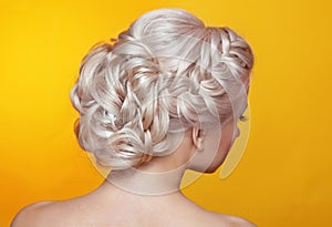 Beauty wedding hairstyle. Bride. Blond girl with curly hair styling photo