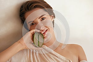 Beauty. Woman With Aloe Vera Slices. Portrait Of Beautiful Model With Naked Shoulder And Natural Makeup.