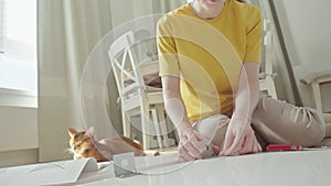 Beauty woman assembling furniture at Home