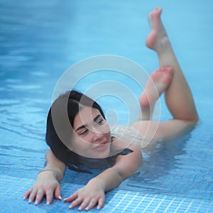 Beauty woman bathing in pool with thermal water in balneotherapy spa, hot springs resorts