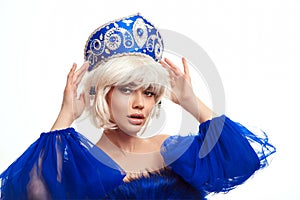 Beauty woman blond portrait. Fashion Russian girl model with hairstyle and kokoshnik