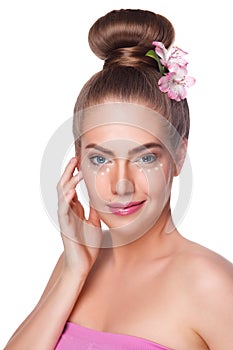 Beauty woman with concealer dots at undereye area isolated photo