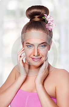 Beauty woman with eye cream spots photo