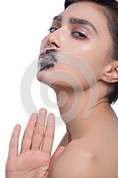 Beauty woman face closeup isolated on black background. Beautiful model girl makeup. Gorgeous brunette lady