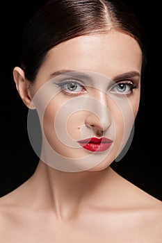 Beauty woman face closeup isolated on black background. Beautiful model girl makeup. Gorgeous lady with closed eyes