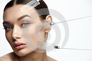 Beauty Woman Face During Face Skin Lift Treatment photo