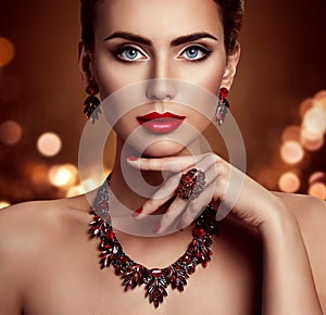 Beauty Woman Face Makeup and Jewelry, Fashion Model Portrait with Jewellery over shining Lights Background