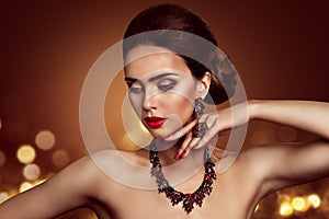 Beauty Woman Face Makeup and Jewelry, Fashion Model Portrait with Jewellery Ring Necklace Earrings over  Lights