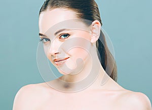 Beauty Woman face Portrait. Beautiful Spa model Girl with Perfect Fresh Clean Skin. Blue background.