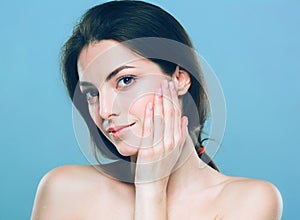 Beauty Woman face Portrait. Beautiful Spa model Girl with Perfect Fresh Clean Skin. Blue background gray