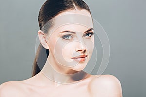 Beauty Woman face Portrait. Beautiful Spa model Girl with Perfect Fresh Clean Skin. Gray background