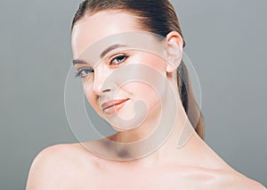 Beauty Woman face Portrait. Beautiful Spa model Girl with Perfect Fresh Clean Skin. Gray background