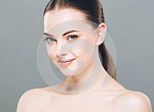 Beauty Woman face Portrait. Beautiful Spa model Girl with Perfect Fresh Clean Skin. Gray background