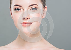 Beauty Woman face Portrait. Beautiful Spa model Girl with Perfect Fresh Clean Skin. Gray background