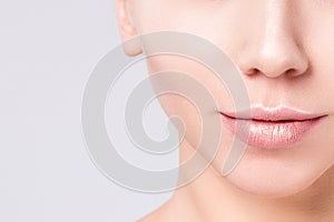 Beauty Woman face portrait. Model girl posing in studio at gray background. Female, cleansing.
