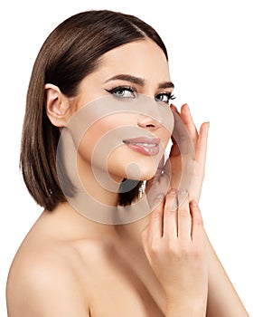 Beauty Woman Face Skin Care. Smiling Model with Natural Make up and Hands on Cheeks looking at camera over White. Women Manicure