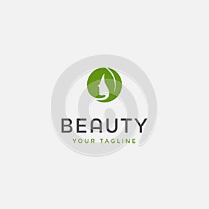 Beauty woman fashion logo. Abstract girl face with green leaf