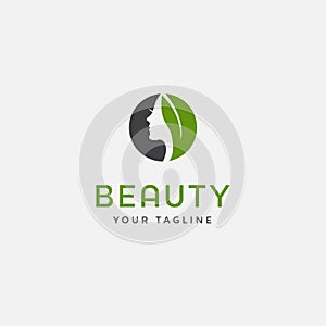 Beauty woman fashion logo. Abstract girl face and green leaf vector