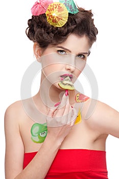 Beauty woman with fruit bodyart and kiwi