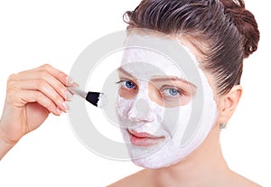 Beauty woman getting facial mask isolated