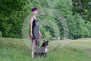 Beauty woman with her dog outdoors