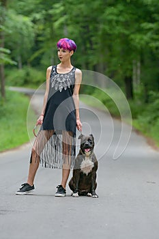 Beauty woman with her dog outdoors