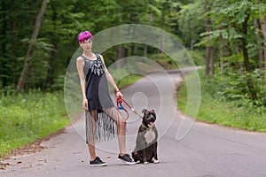 Beauty woman with her dog outdoors