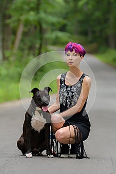 Beauty woman with her dog outdoors