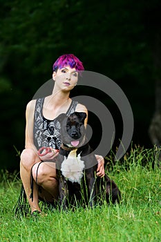 Beauty woman with her dog outdoors