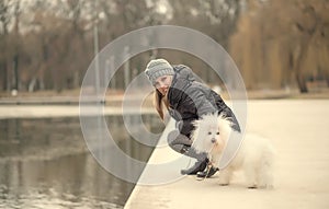 Beauty woman and her dog in the park