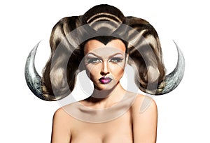 Beauty woman with horns on hair and ring in nose