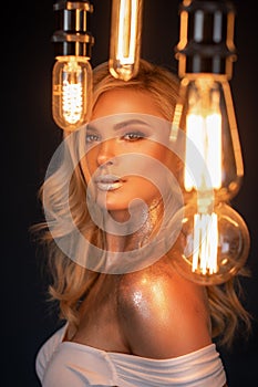 Beauty woman with light bulbs